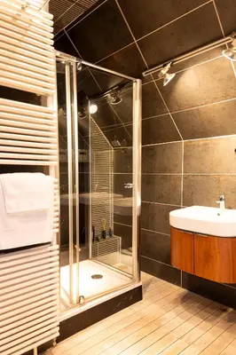 a bathroom with a shower and a sink at Broekemmolen - Nature getaway & green spot in Bilzen