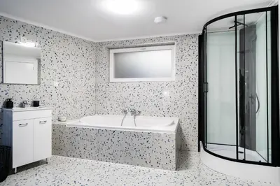 a bathroom with a tub and a sink at Loft36 in Herstal