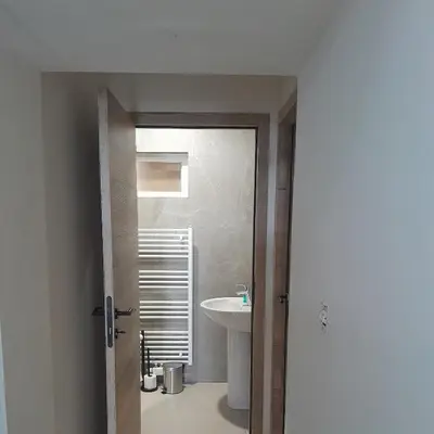 a bathroom with a sink and a white toilet at RELAX Room in Chaudfontaine