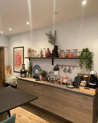 a kitchen with a counter with plants on it at Quiet villa Exceptional view and its exterior in Liège
