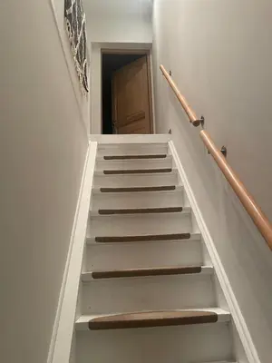 a stairway with white steps and a door at Quiet villa Exceptional view and its exterior in Liège