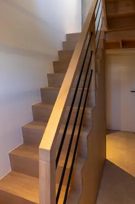 a staircase with wood and metal railings in a house at Villa Armande in Zammelen