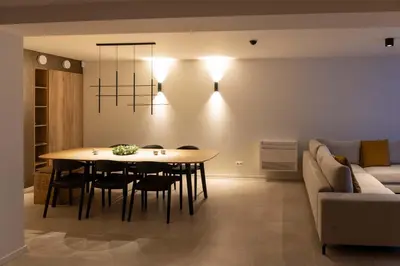 a living room with a table and a couch at Villa Armande in Zammelen