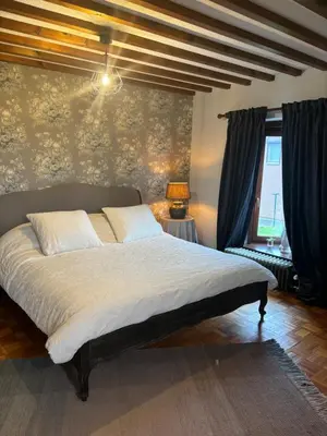 a bedroom with a large bed in a room at Sophia Rooms 14 in Maasmechelen