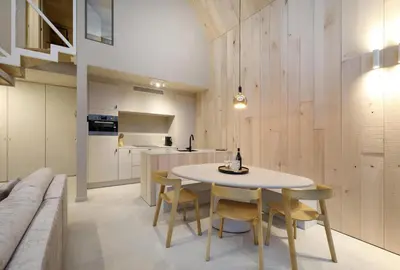 a kitchen and dining room with a table and chairs at Lodge - 4 personen - Woodz Lodges in Heusden - Zolder