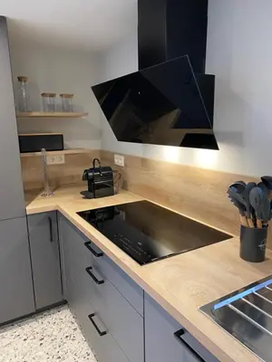 a kitchen with a sink and a stove top oven at Ô Gadot in Chaudfontaine