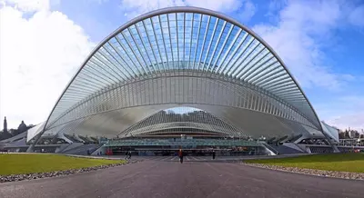 a large white building with a curved roof at LifeinLiege in Liège