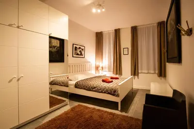 a bedroom with a bed and a dresser in it at 