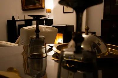 a table with a bottle and glasses on it at 