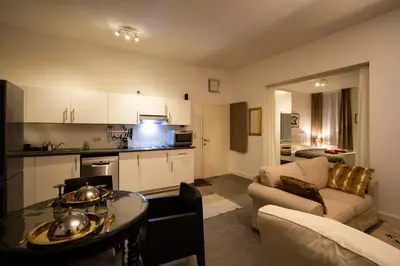 a living room with a couch a table and a kitchen at 