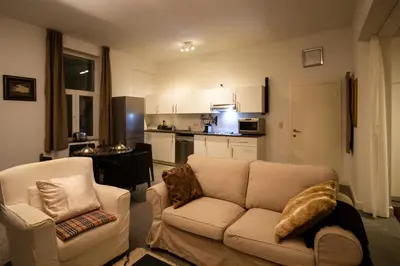 a living room with a couch and a kitchen at 