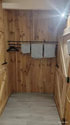 a room with two towels on a wooden wall at B&B Halen in Halen