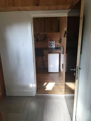 an open door into a kitchen with a table at B&B Halen in Halen