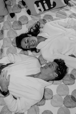 a man and a woman laying on a bed at Sfeervolle B&B in de Voerstreek Lo-Ghis - met Zwembad in Voeren