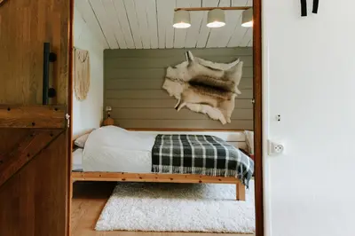 a bedroom with a bed with a skull on the wall at Le chalet Sud in Verviers