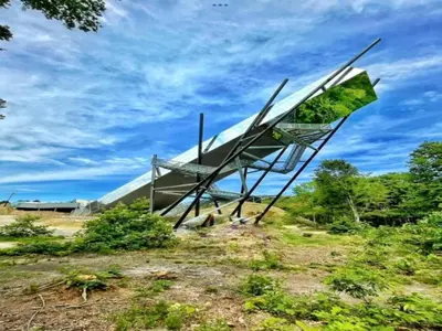 a sculpture of a plane sitting on top of a field at Zutendaal Forest Retreat in Zutendaal