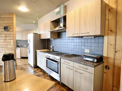 a kitchen with a stove and a refrigerator at Halinsart in Trooz