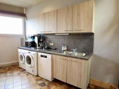 a kitchen with a sink and a washing machine at Halinsart in Trooz