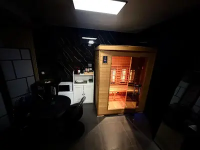 a small kitchen with a door in a room at La home Gold Jacuzzi in Seraing