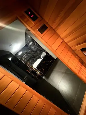 an overhead view of a kitchen with wooden cabinets at La home Gold Jacuzzi in Seraing
