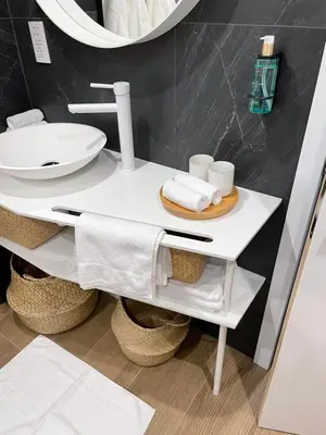 a bathroom with a white sink and a mirror at Ô voda in Waremme