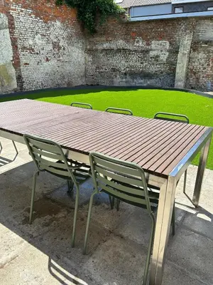 a wooden picnic table with two chairs around it at Vakantiehuis Twenty Six in Hasselt