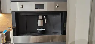 a microwave oven with a cup inside of it at Comme chez Soi in Liège