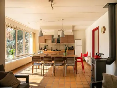 a kitchen with a table and chairs in a room at Holiday Home in Lanklaar near Forest Trails in Lanklaar