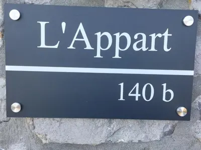 a sign on a wall with the name of a street at L'Appart - New Appartement - Free Parking - Self Check-in - Terrasse in Eynatten