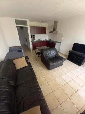 a living room with a couch and a kitchen at Ap78 Nature Ardennes Economy class apartment in La Calamine