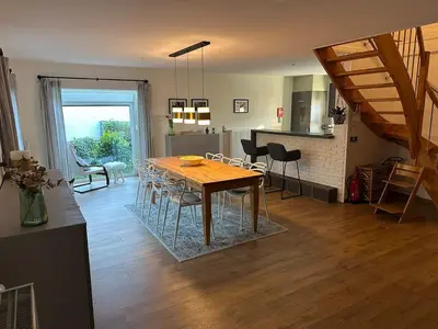a kitchen and dining room with a table and chairs at Raelax in Raeren