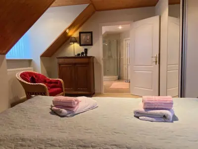 a bedroom with a bed with two towels on it at Nachtegaal in Dilsen-Stokkem