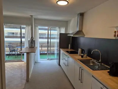 a kitchen with a sink and a counter top at Hasselita in Hasselt