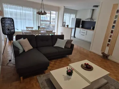a living room with a couch and a table at Hasselita in Hasselt