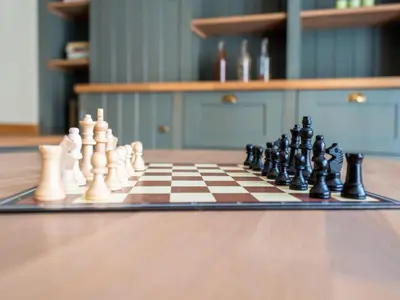 a chess board with chess pieces on a table at Farmhouse including studio with Garden in Alken