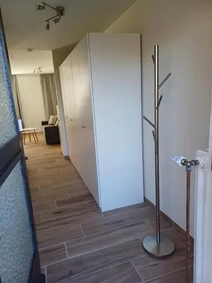 a hallway with a white door and a floor at Sunny and bright apartment Kelmis La Calamine Neu Moresnet in La Calamine