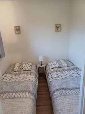 two beds sitting next to each other in a bedroom at Sunny and bright apartment Kelmis La Calamine Neu Moresnet in La Calamine