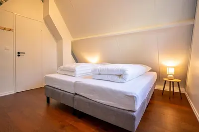 two pillows on a bed in a room at Boshuisje Rekem - Azure in Lanaken