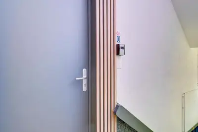 a door in a hospital room with a doorhaarhaar at Le cocon de la gare - centre in Liège