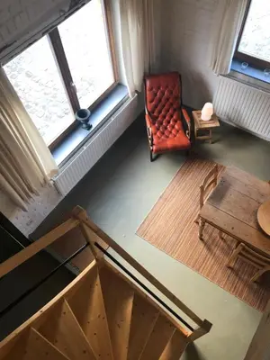 an overhead view of a room with a chair and a table at Land van Engelingen in Helshoven