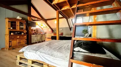 a bedroom with a bunk bed in a room at La Cachette d 'Amercoeur in Liège