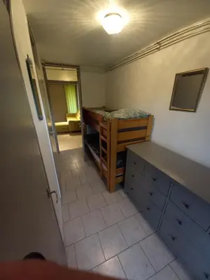 a small room with a bedroom with a bed at Ap76 Nature Ardennes Economy class apartment in La Calamine