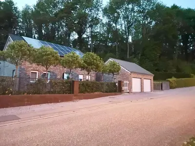 a house with solar panels on top of it at Au Natur'elle in Gemmenich