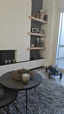 a living room with a coffee table in a room at holiday home Zonnestraal in Zonhoven