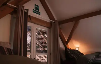 a room with a window and a door in a room at Bakhuisje Peer in Peer