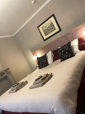 a bedroom with a bed with two towels on it at Guesthouse 't Goed Leven in Stokrooie