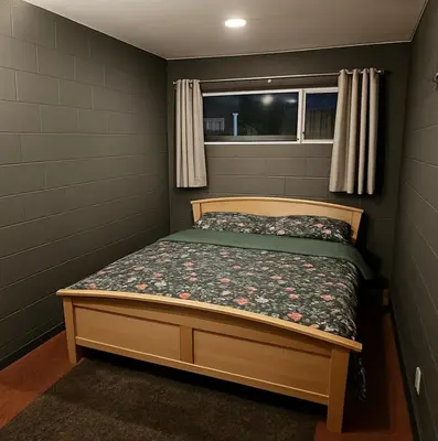 a small bedroom with a bed and a window at L'appart en gare in Welkenraedt