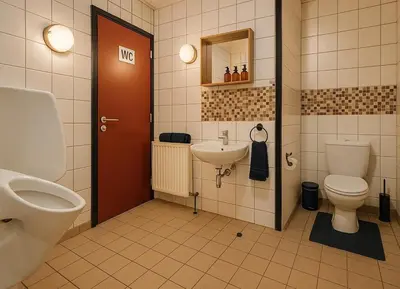 a bathroom with a toilet and a sink at L'appart en gare in Welkenraedt
