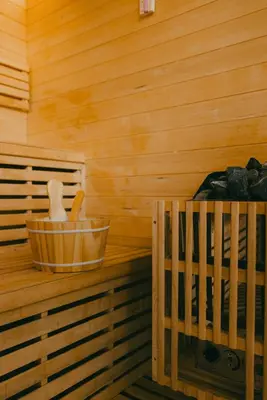 a wooden sauna with a wooden tub at Essential by cin in Zonhoven