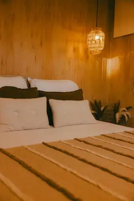 a bedroom with two beds and a chandelier at Essential by cin in Zonhoven
